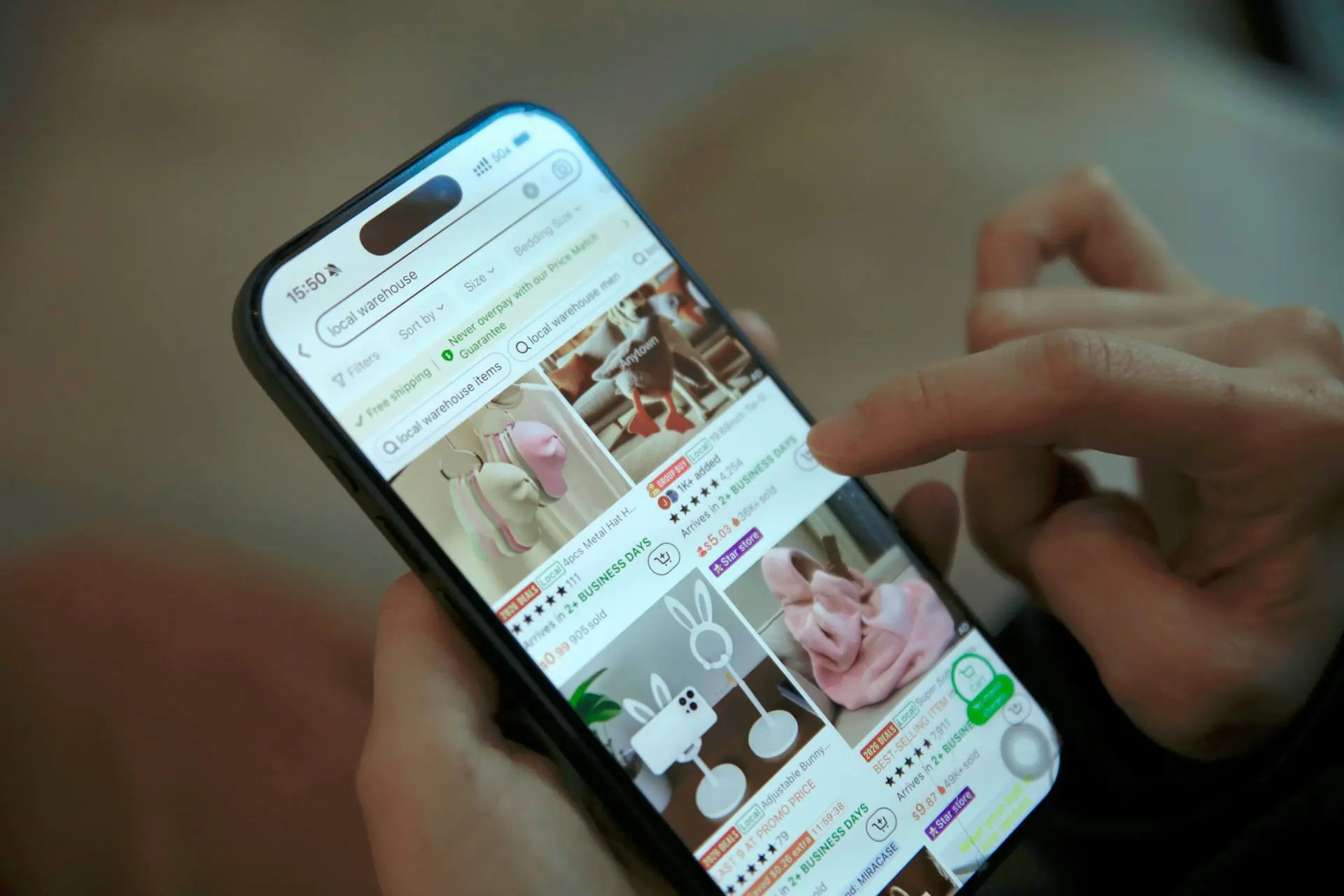 Person scrolling an online shop on a phone