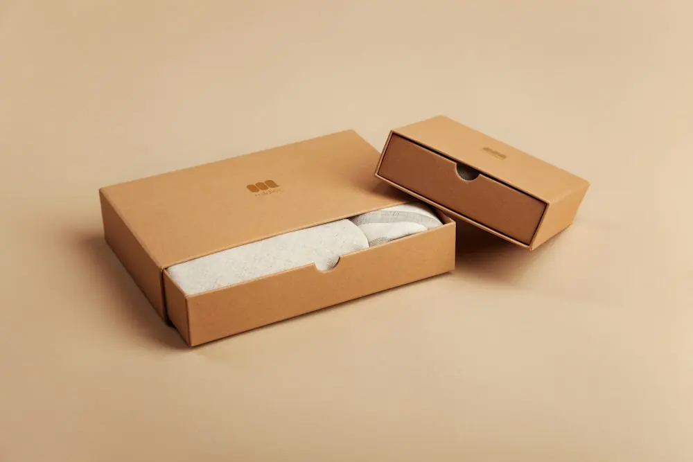 Branded shipping boxes on a warm background