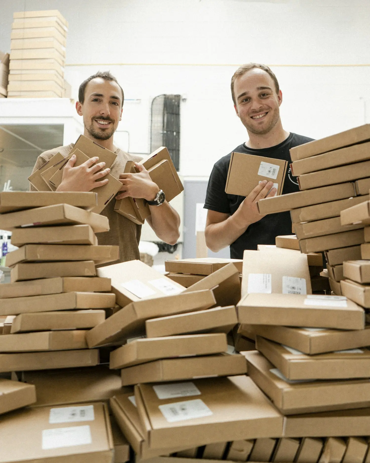Two people packing parcels